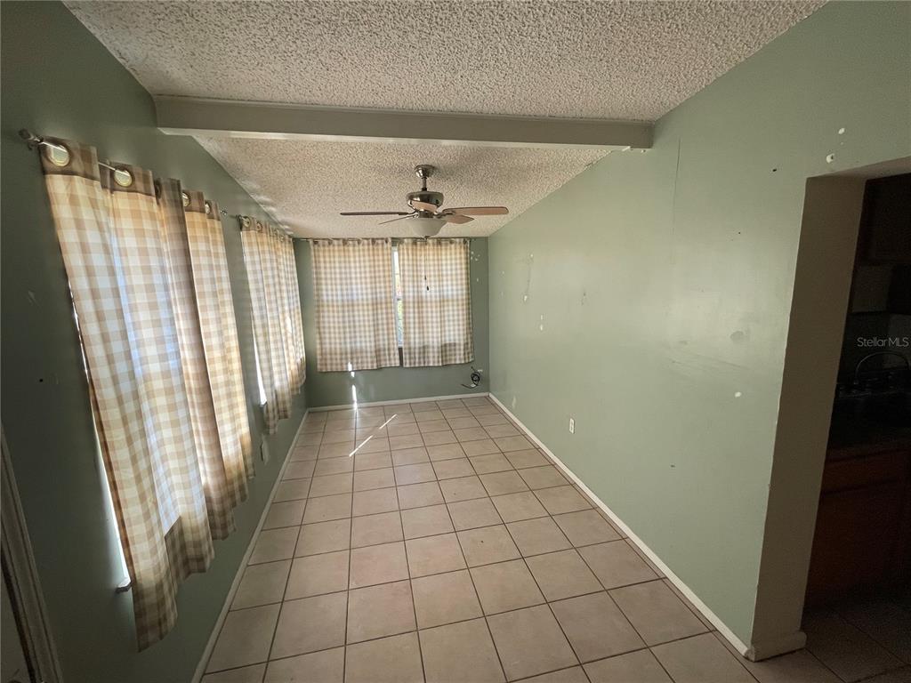 632 Cardinal Street Ocoee, FL 34761 - Photo 9 of 29 a view of an empty room with a window