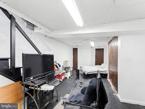 a room with furniture and flat screen tv