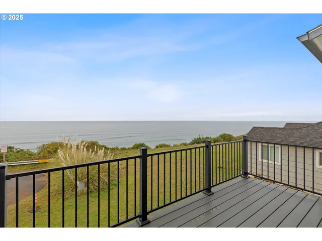 a view of balcony with wooden floor