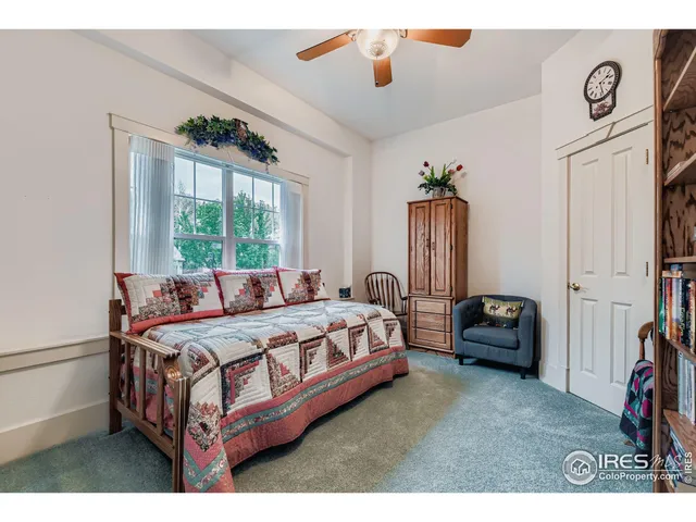 a bathroom with a sink vanity granite toilet and a mirror