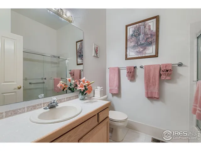 a living room with furniture and a book shelf