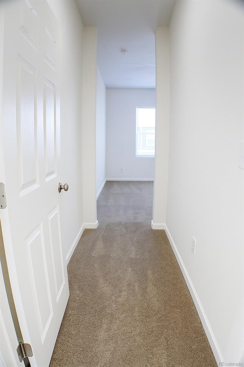 3607 East Uintah Street, Unit 102 Colorado Springs, CO 80909 - Photo 14 of 21 a view of a hallway