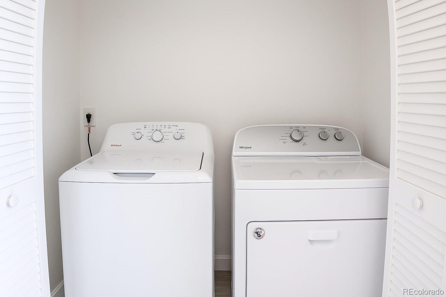 3607 East Uintah Street, Unit 102 Colorado Springs, CO 80909 - Photo 9 of 21 a utility room with dryer and washer