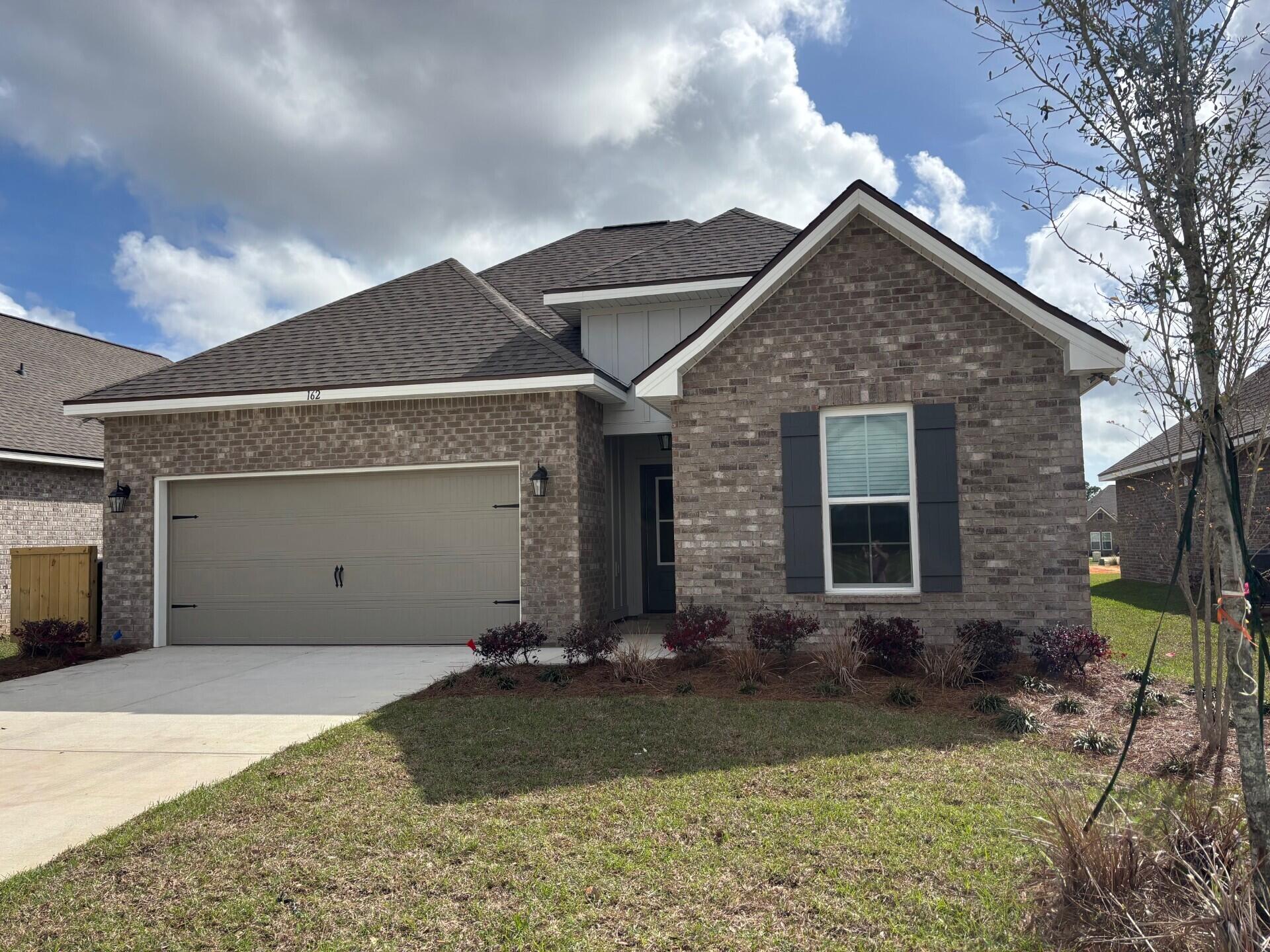 162 Natureview Way Ponce de Leon, FL 32455 - Photo 1 of 7 front view of a house with a yard