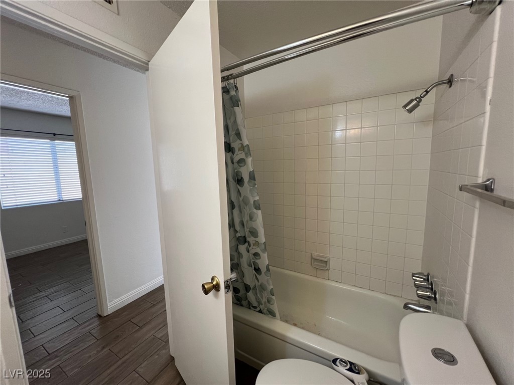 3737 Prosperity Lane Las Vegas, NV 89147 - Photo 24 of 36 Full bathroom featuring shower / bathtub combination with curtain and dark wood finished floors
