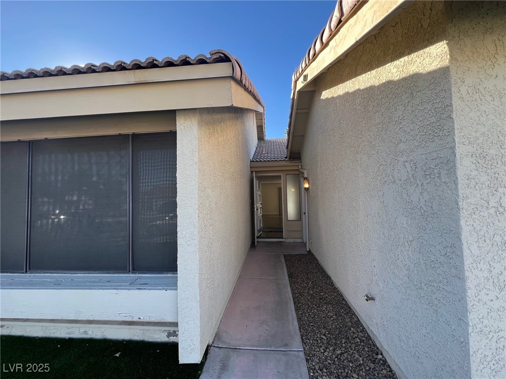3737 Prosperity Lane Las Vegas, NV 89147 - Photo 4 of 36 Property entrance featuring stucco siding and a tile roof