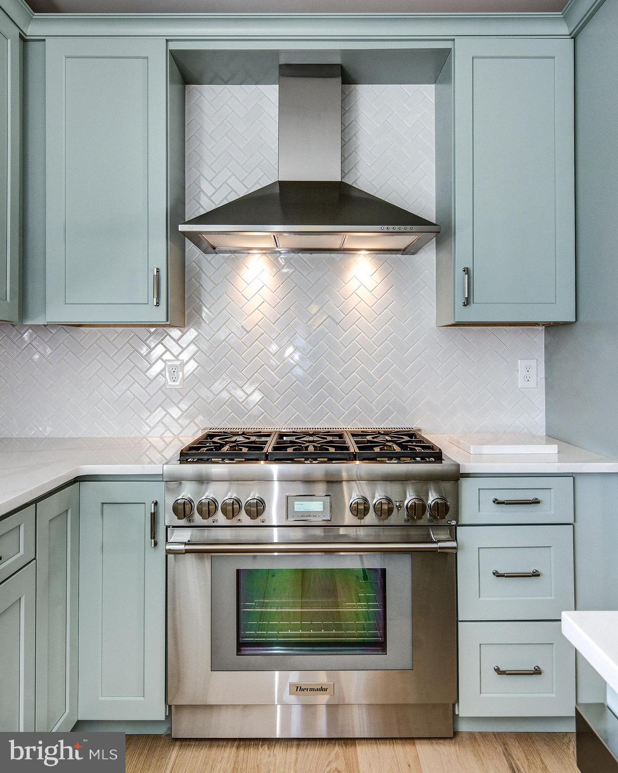 20 East Redman Avenue, Unit C Haddonfield, NJ 08033 - Photo 15 of 43 a stove top oven sitting inside of a kitchen