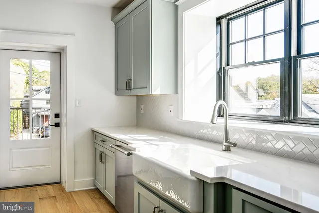 a kitchen with granite countertop a sink and a window