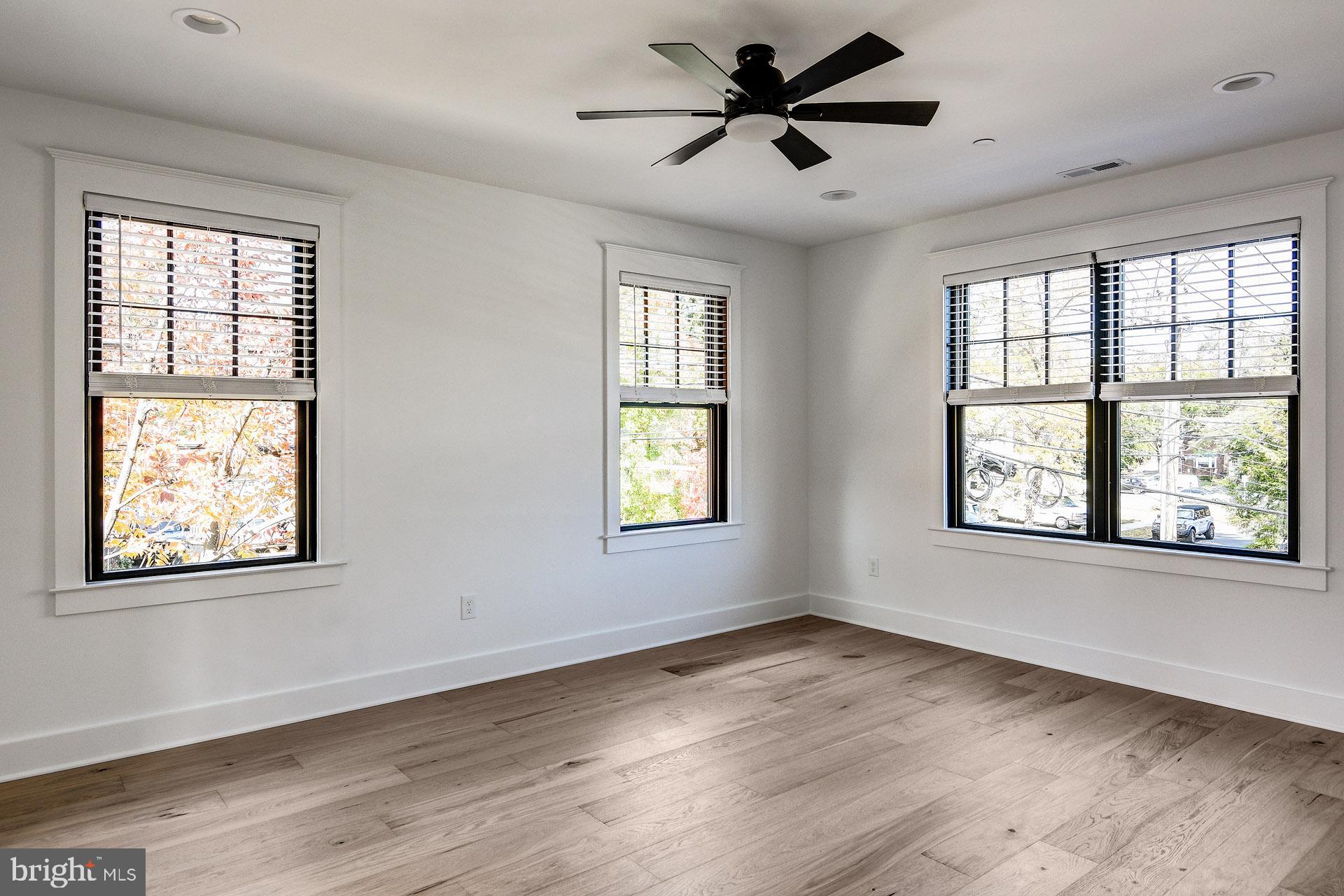 20 East Redman Avenue, Unit C Haddonfield, NJ 08033 - Photo 18 of 43 a view of an empty room window and wooden floor