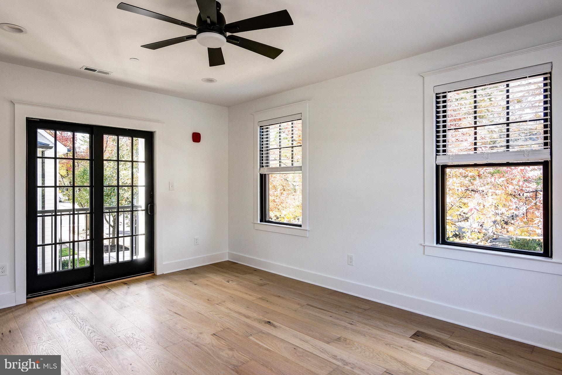 20 East Redman Avenue, Unit C Haddonfield, NJ 08033 - Photo 20 of 43 a view of an empty room with wooden floor and a window