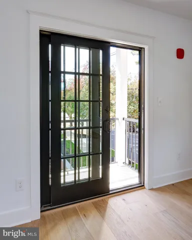 a view of a room that has a large window