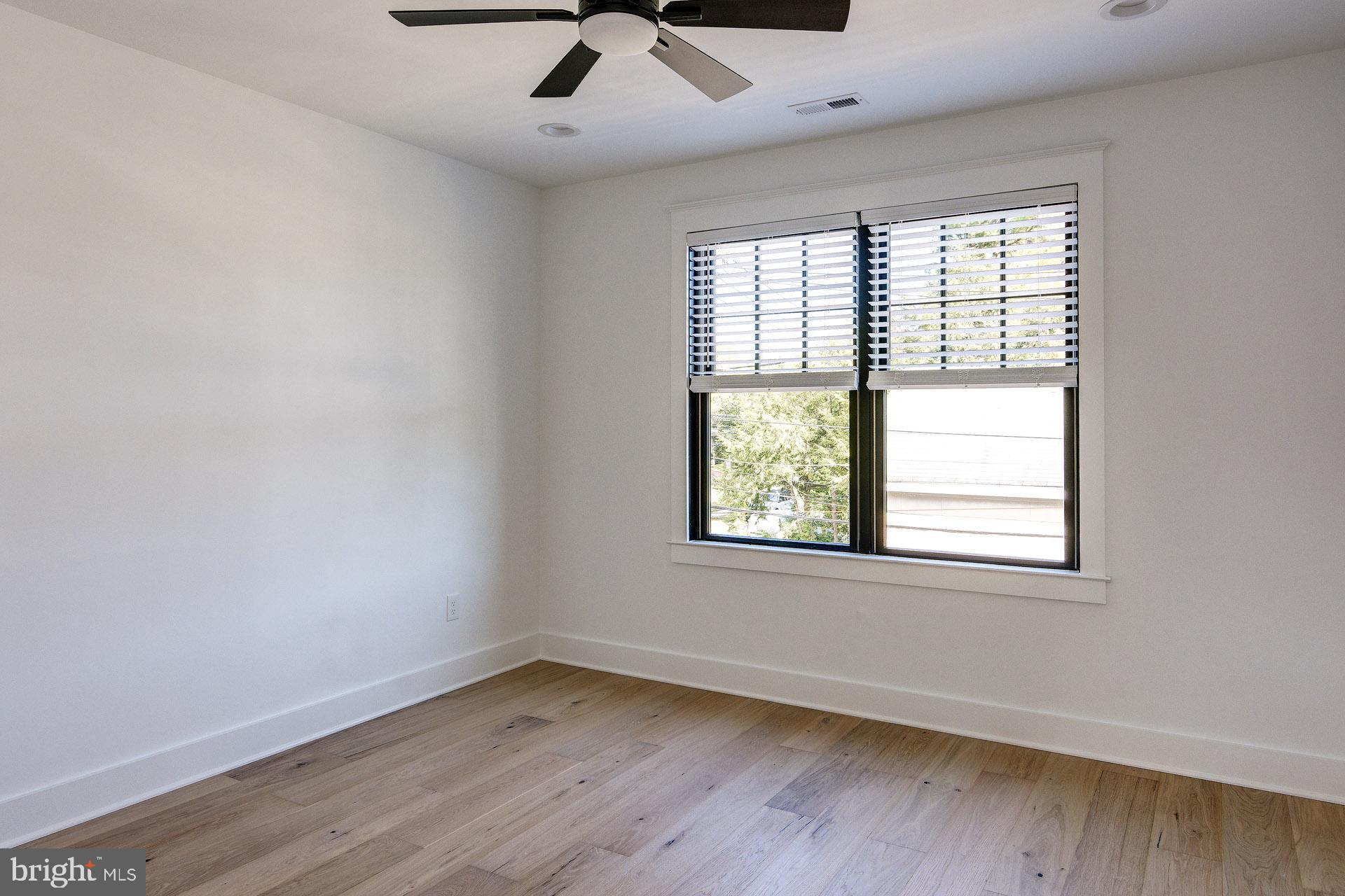 20 East Redman Avenue, Unit C Haddonfield, NJ 08033 - Photo 31 of 43 an empty room with a window and ceiling fan