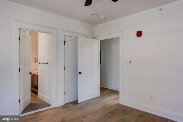 a view of an entryway with wooden floor