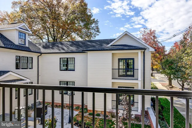 a view of a brick house with a large window