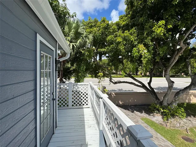 a view of balcony and yard