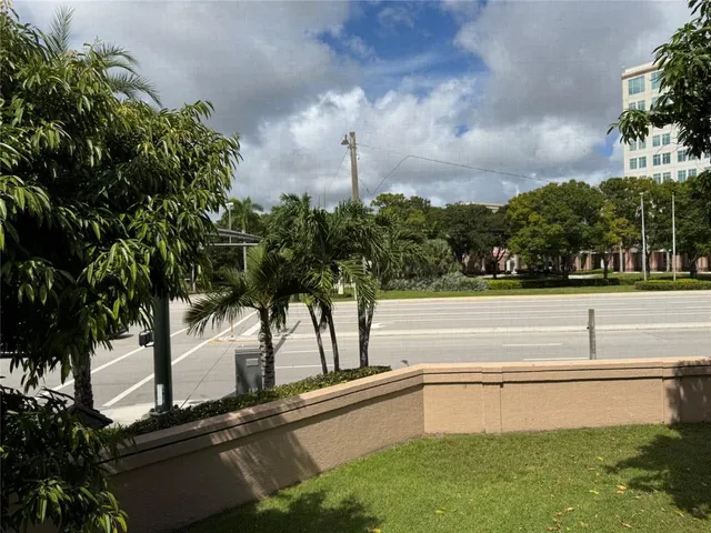 a view of a swimming pool with a yard