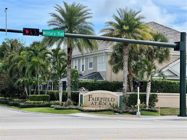 a view of a house with a yard and plants