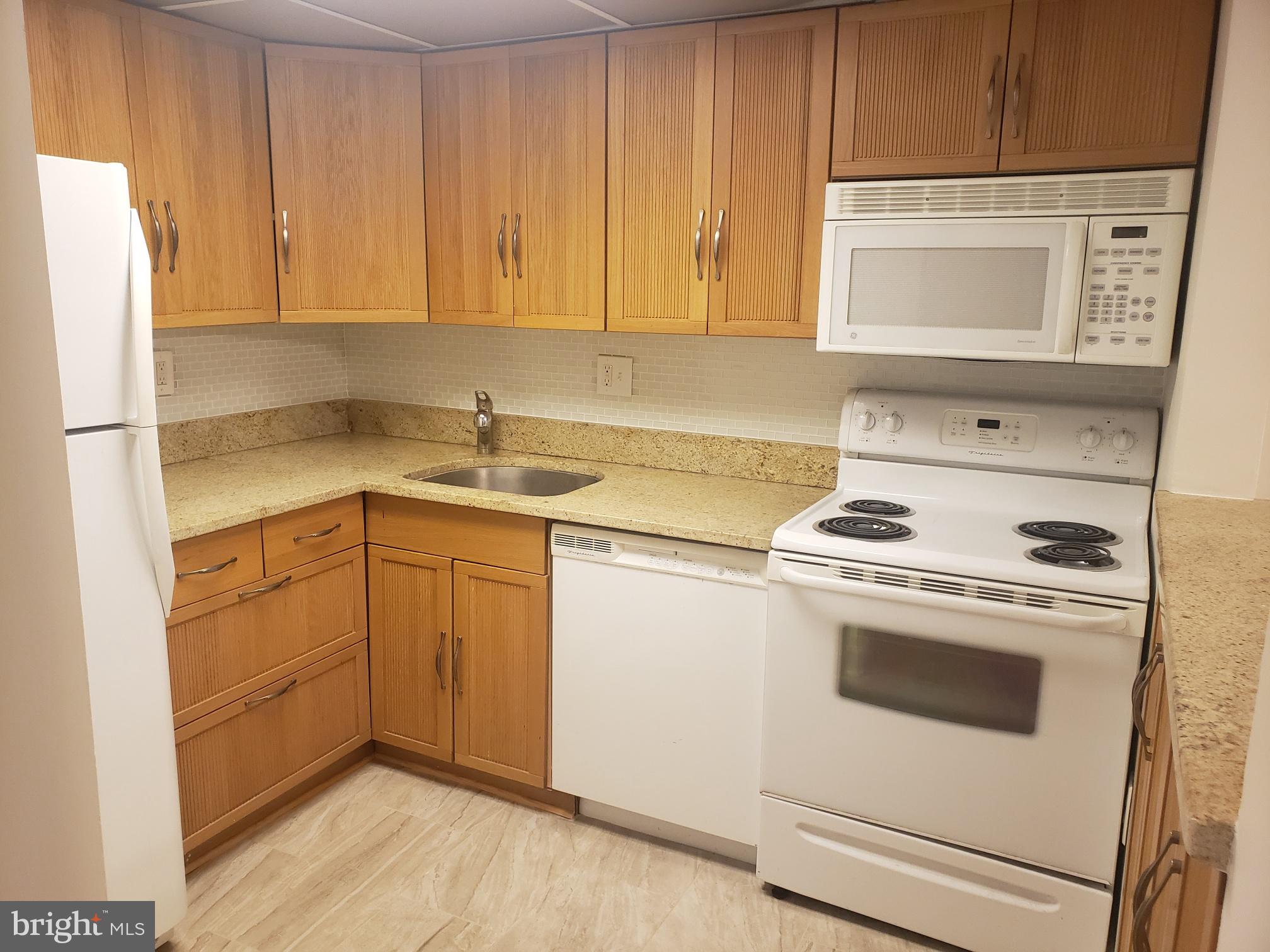 1747 Q Street Northwest, Unit 5 Washington, DC 20009 - Photo 7 of 15 Kitchen with ceramic floor.