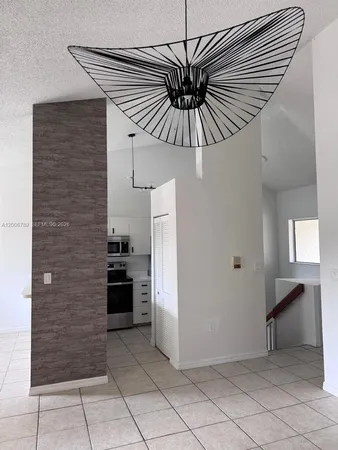 a view of a hallway to rooms
