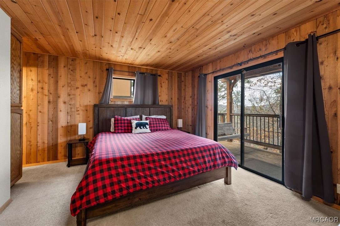 1414 Klamath Road Big Bear City, CA 92314 - Photo 12 of 28 a bedroom with a bed and a window