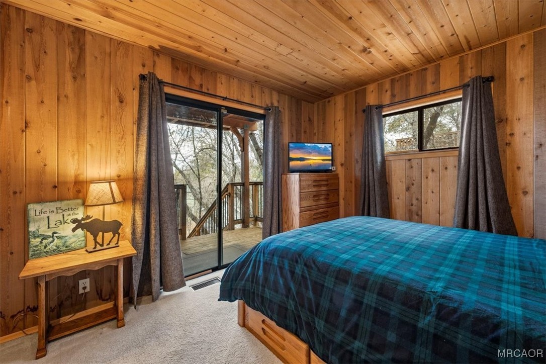 1414 Klamath Road Big Bear City, CA 92314 - Photo 17 of 28 a bedroom with a bed and a dresser