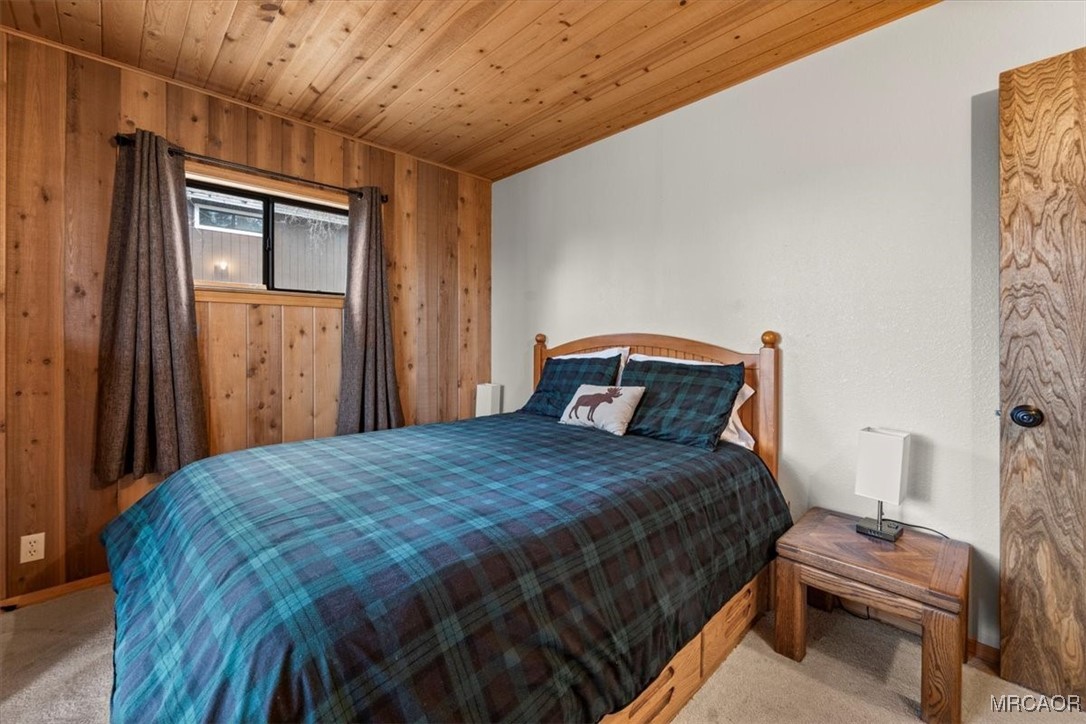 1414 Klamath Road Big Bear City, CA 92314 - Photo 18 of 28 a bedroom with a bed and a window