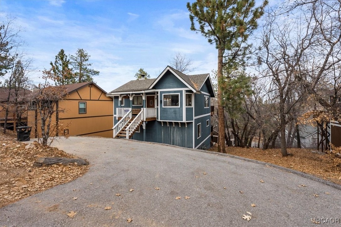 1414 Klamath Road Big Bear City, CA 92314 - Photo 27 of 28 a view of a house with a yard covered in snow