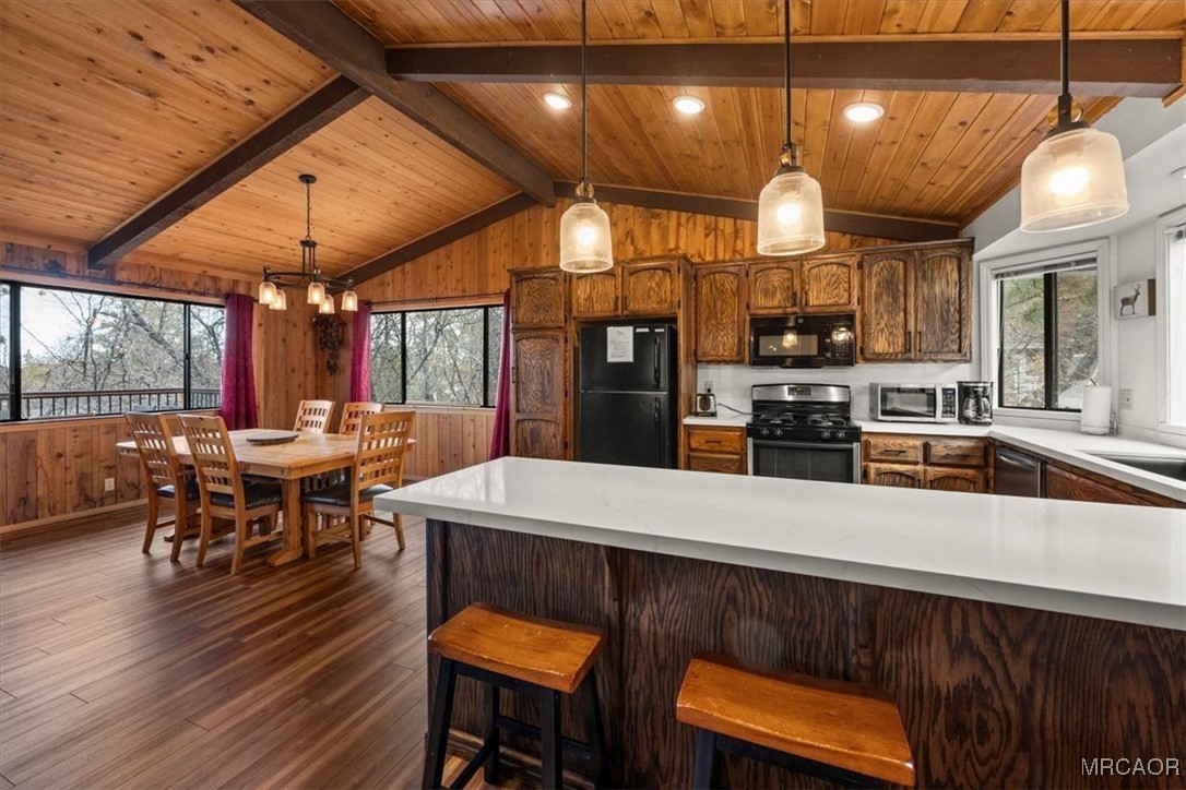 1414 Klamath Road Big Bear City, CA 92314 - Photo 5 of 28 a large kitchen with a table and chairs