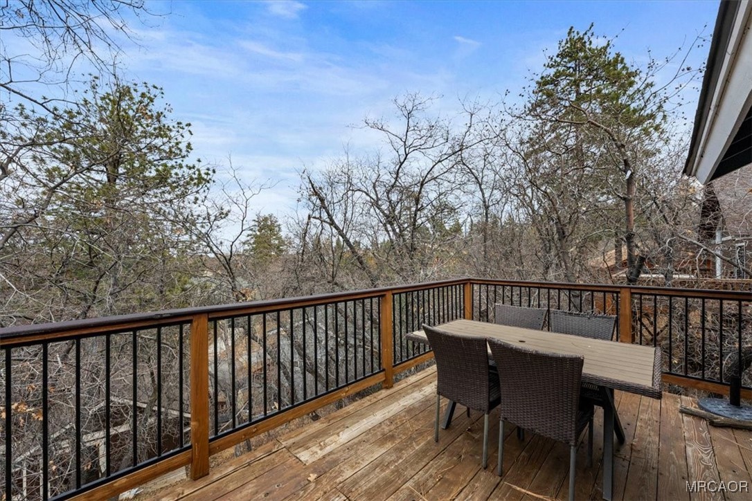 1414 Klamath Road Big Bear City, CA 92314 - Photo 9 of 28 a view of a chair and table on the deck