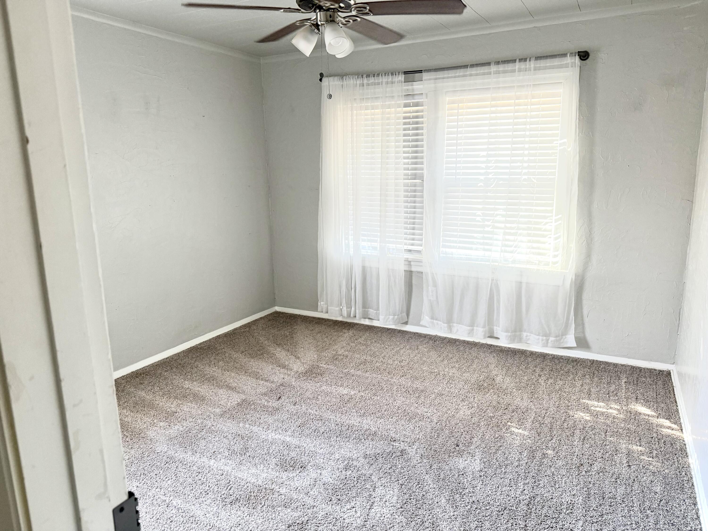 1906 25th Street Lubbock, TX 79411 - Photo 23 of 24 an empty room with a window