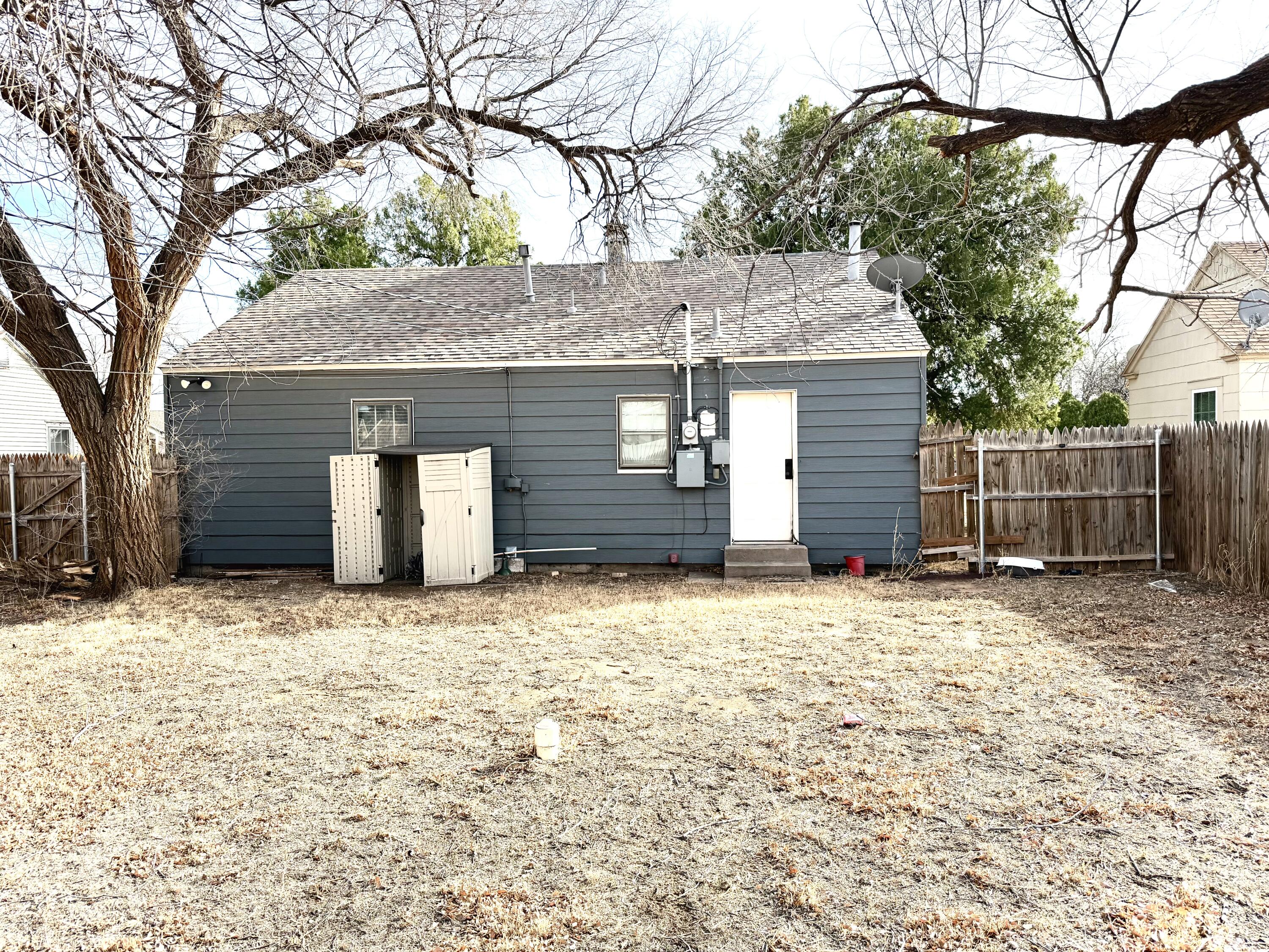 1906 25th Street Lubbock, TX 79411 - Photo 24 of 24 a house that has a tree in front of it