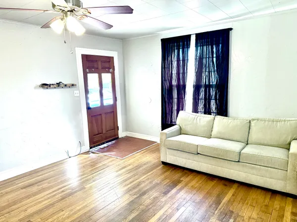 a kitchen with a refrigerator and a stove