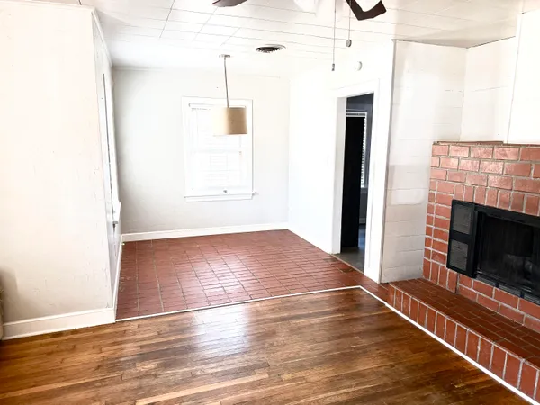 a kitchen with a stove a refrigerator and a sink