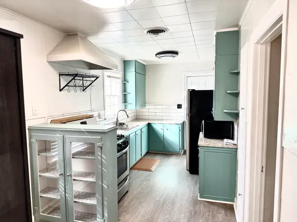 a view of a bathroom with a shower and a tub
