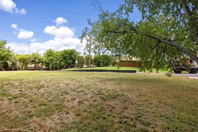 a view of outdoor space with deck and trees