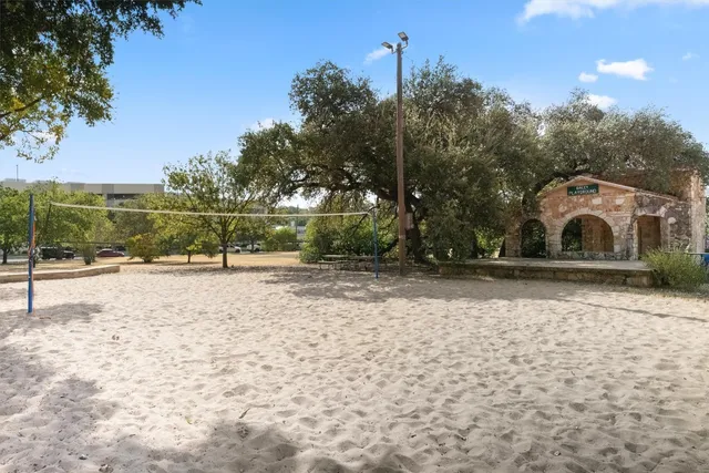 a view of a park with large trees