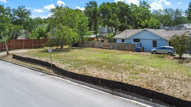 a view of a wooden deck and a yard