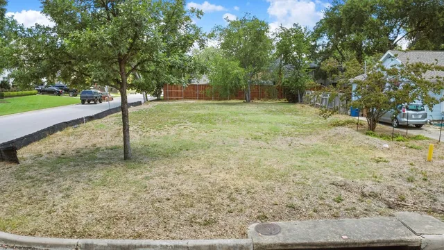 a view of a yard with trees