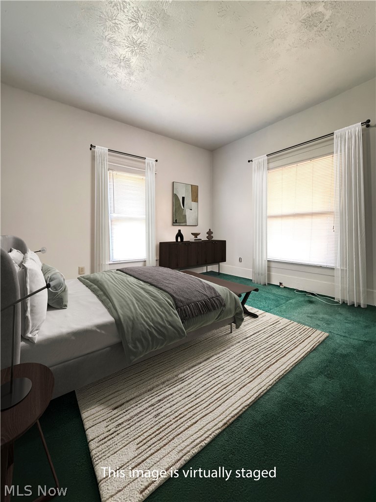 54 Spring Street Struthers, OH 44471 - Photo 9 of 21 First Floor Primary Bedroom Virtually Staged