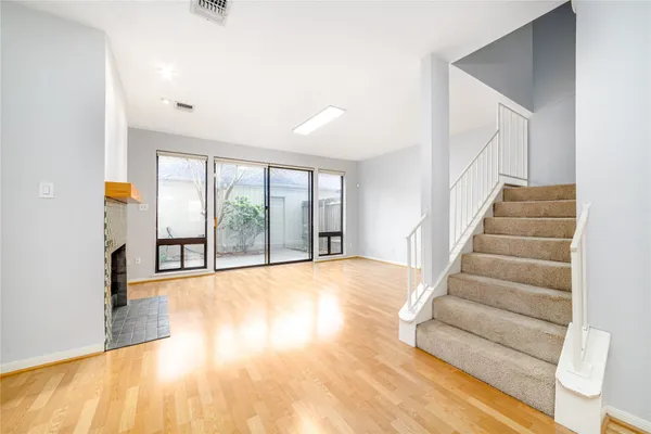 a view of an entryway with wooden floor