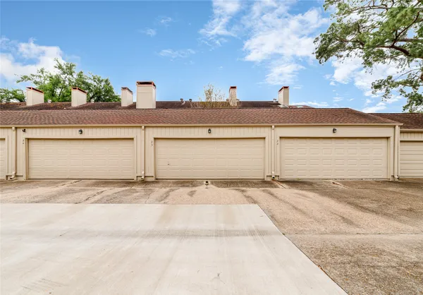 a view of the house and a garage