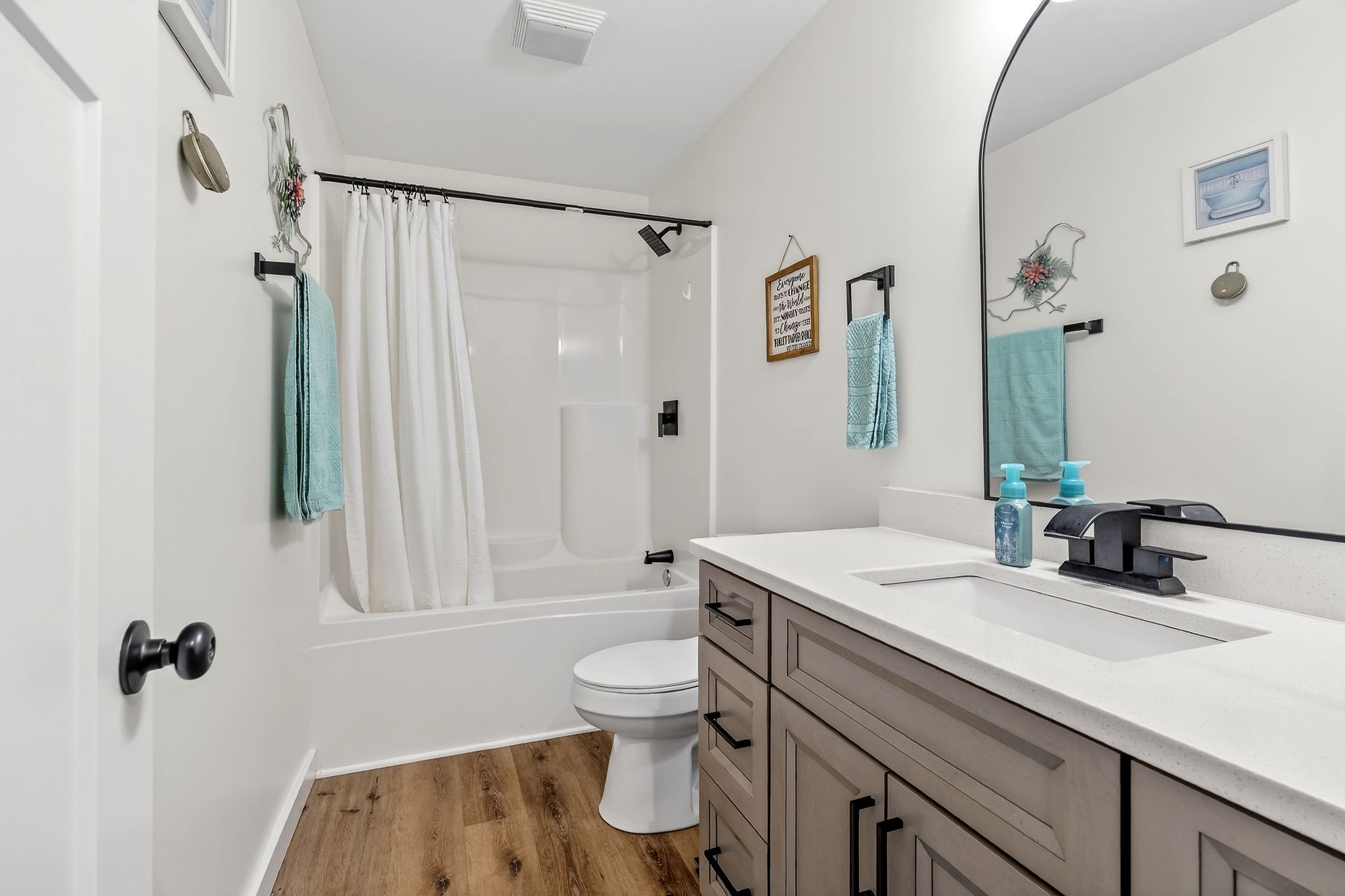 1004 North Spring Street Sparta, TN 38583 - Photo 15 of 30 a bathroom with a sink a toilet and shower