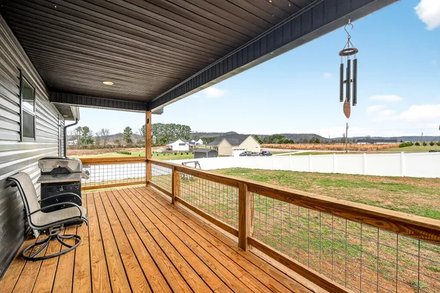 a view of a balcony with wooden floor