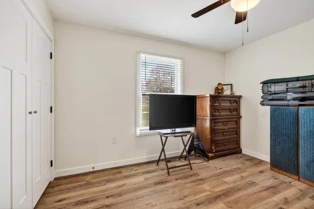 a view of work space with furniture and a window