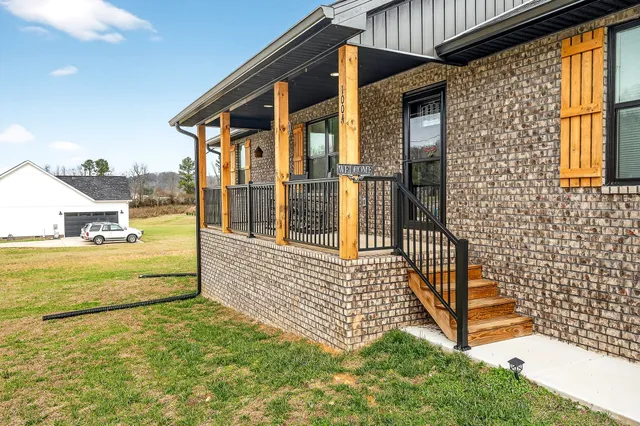 a view of swimming pool with a house in the background