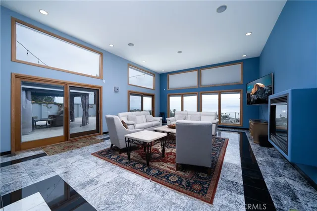 a living room with furniture and a rug