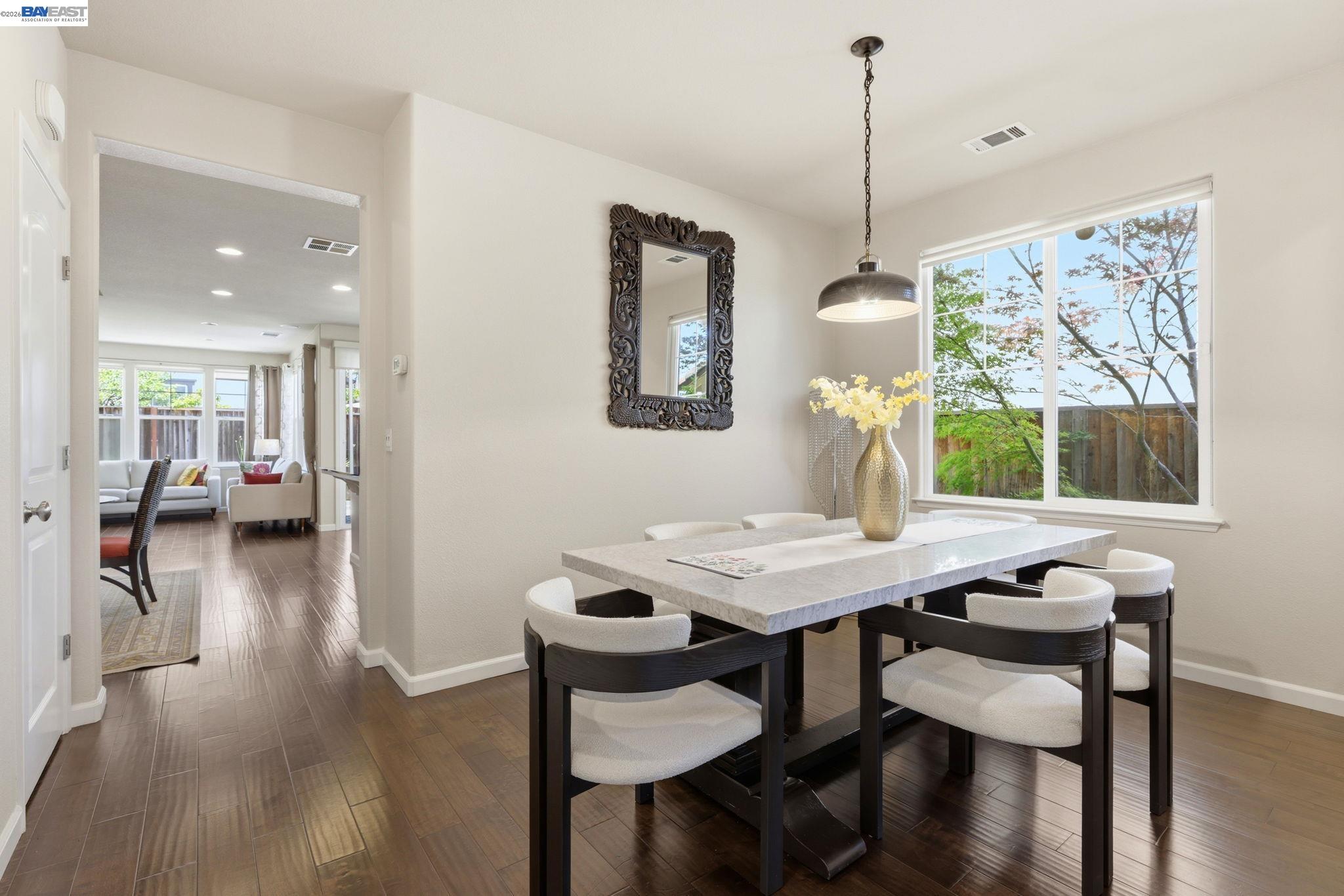 5029 Queensbury Way San Ramon, CA 94582 - Photo 14 of 58 a view of a dining room with furniture window and wooden floor