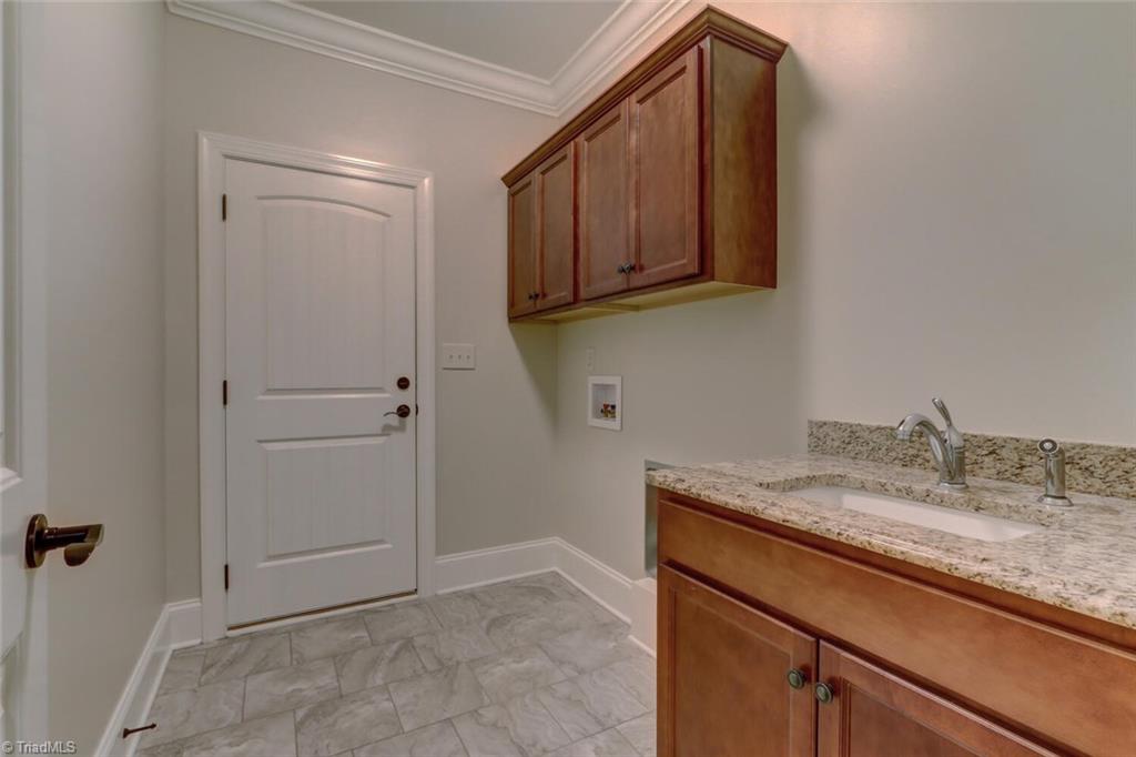 8501 Billet Place Oak Ridge, NC 27310 - Photo 23 of 30 Laundry room off single garage and outside this door is an awesome drop zone for book bags, coats and shoes!