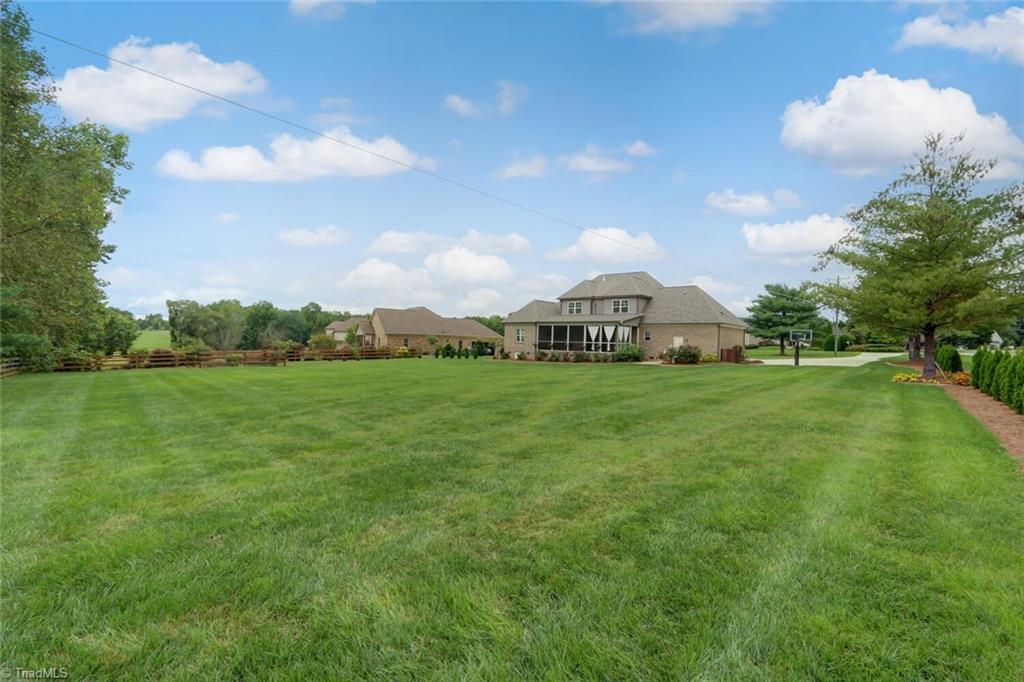 8501 Billet Place Oak Ridge, NC 27310 - Photo 29 of 30 The backyard is perfect for kids and pets!!
