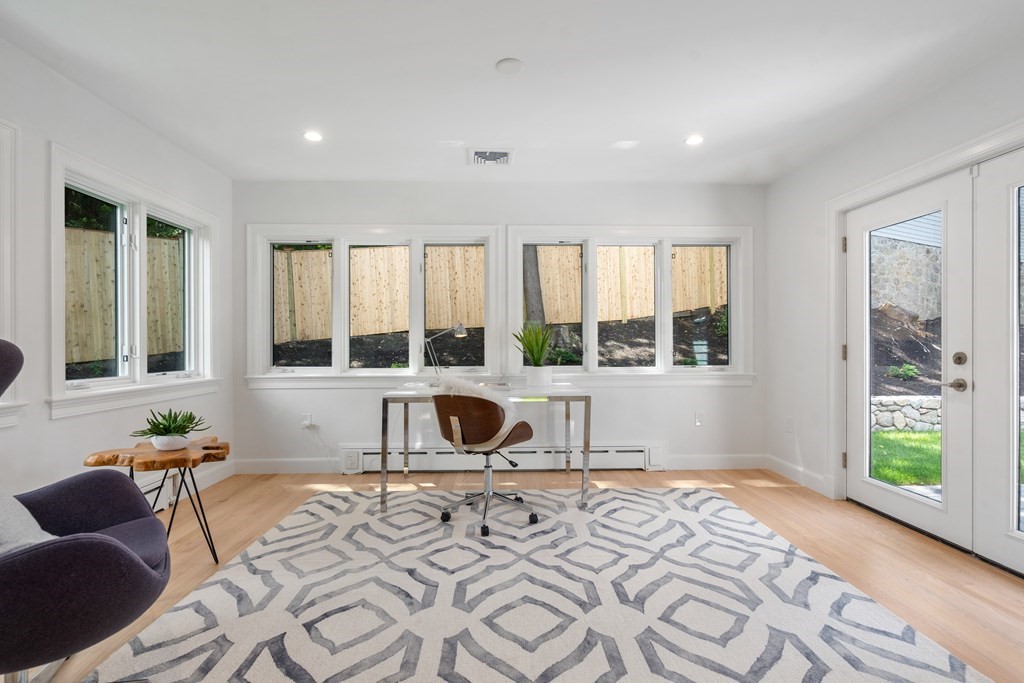 30 Clinton Road Brookline, MA 02445 - Photo 17 of 19 a living room with furniture and a large window